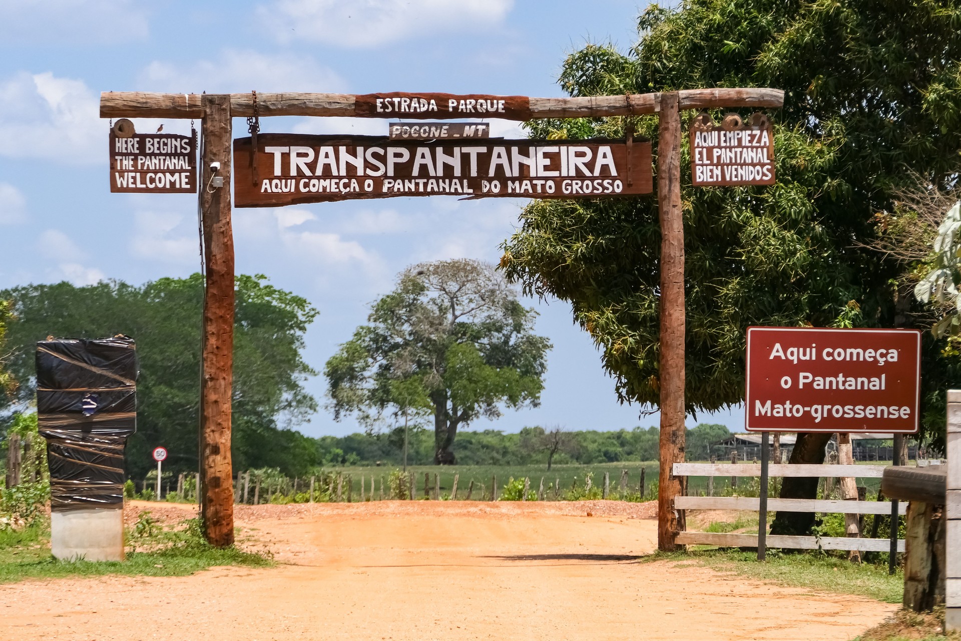 Entrance Gate of Transpantaneira with green tree in background, Pantanal Wetlands