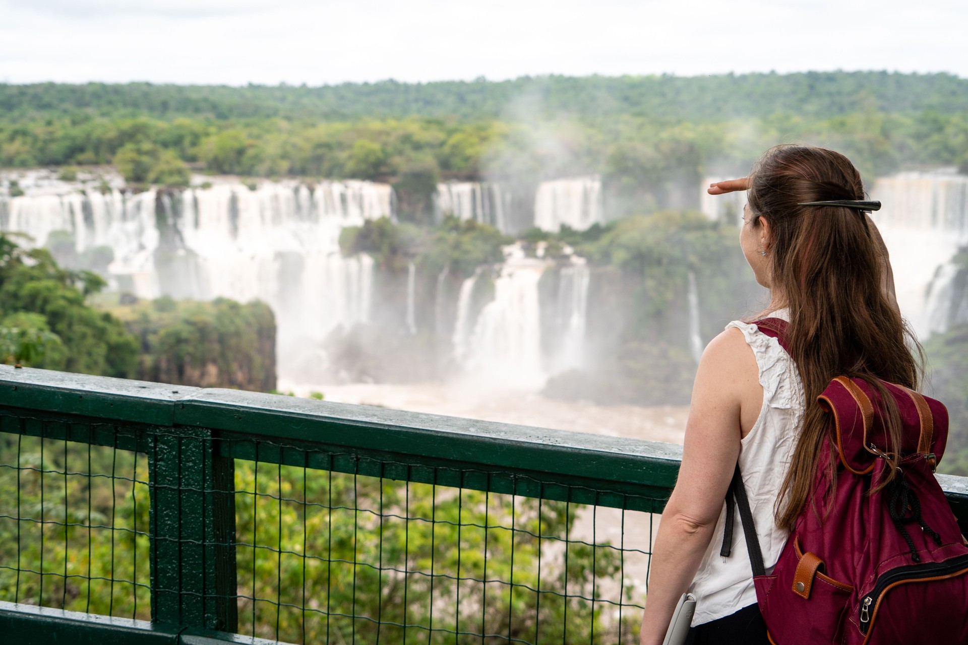 Tourist discovering the Iguazú Falls, Brazil.